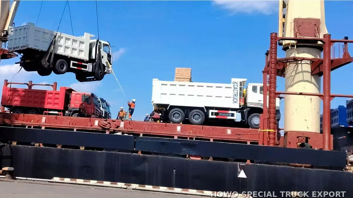 HOWO dump trucks being loaded onto a ship for export