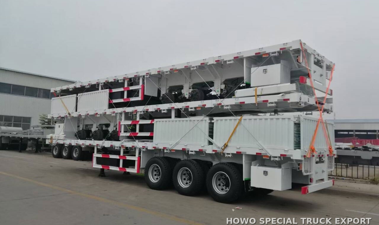 Semi-remorque à ridelles 3 essieux 60 t 3 AXLE FENCE CARGO 60TON — traitement anticorrosion par cire et préparation pour l’expédition maritime en RORO